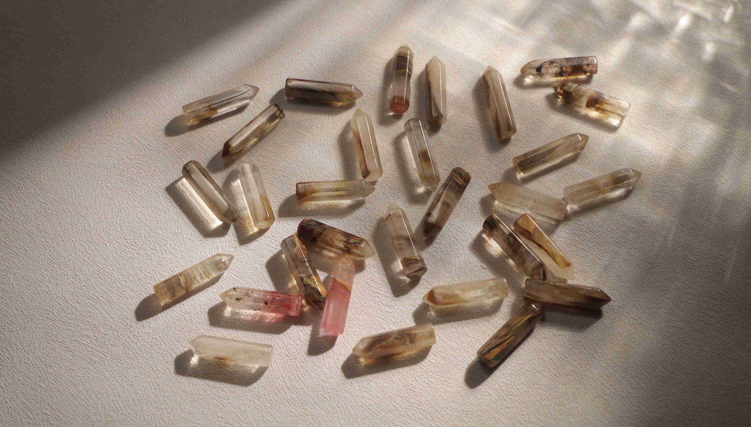 Refined tiger’s eye natural gemstones displayed in soft light, representing Silvbreeze’s material philosophy and craftsmanship