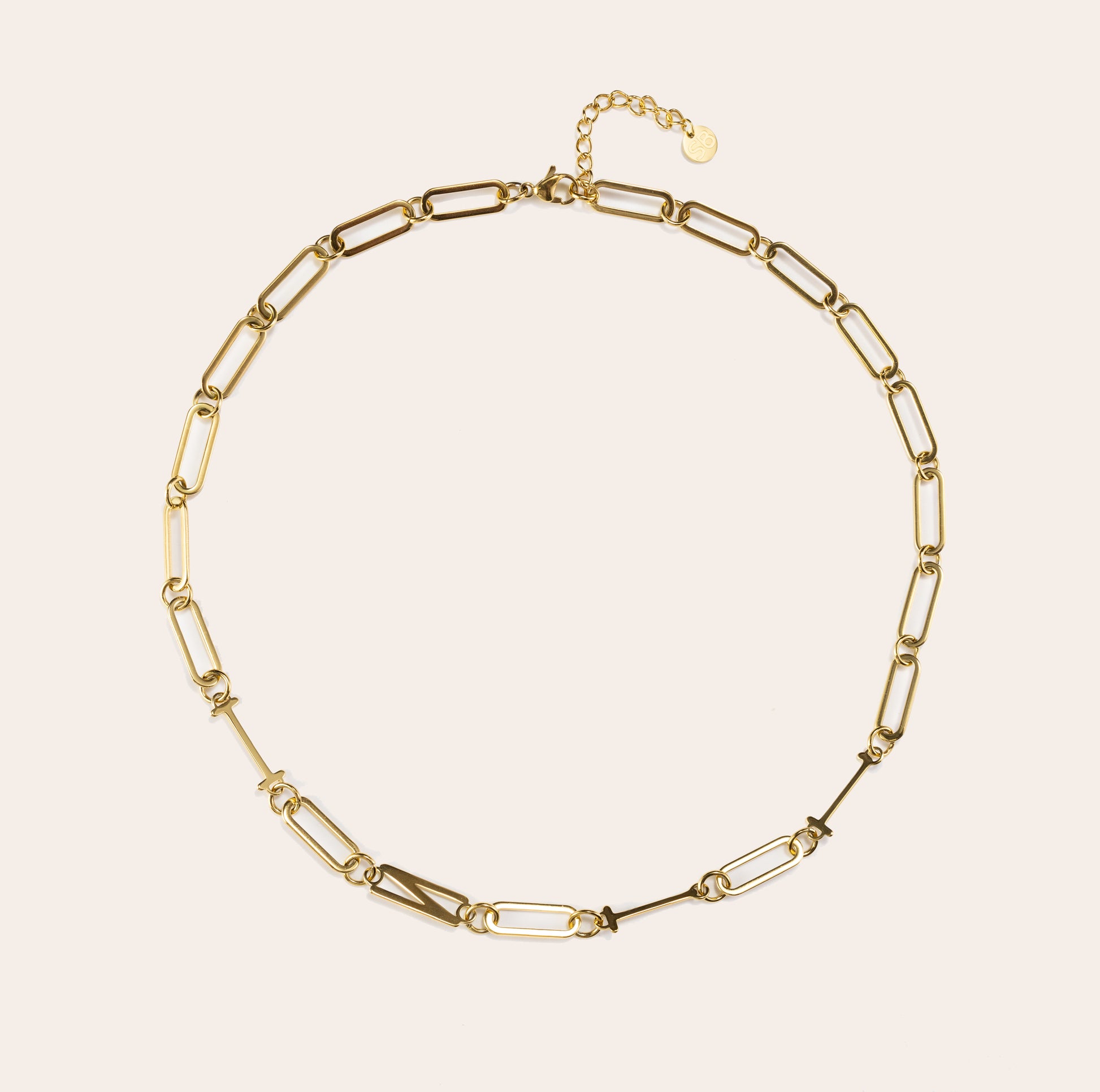INTJ gold MBTI personality paperclip chain necklace displayed in a circular layout on a clean beige background, featuring minimalist link design and 18K gold finish.
