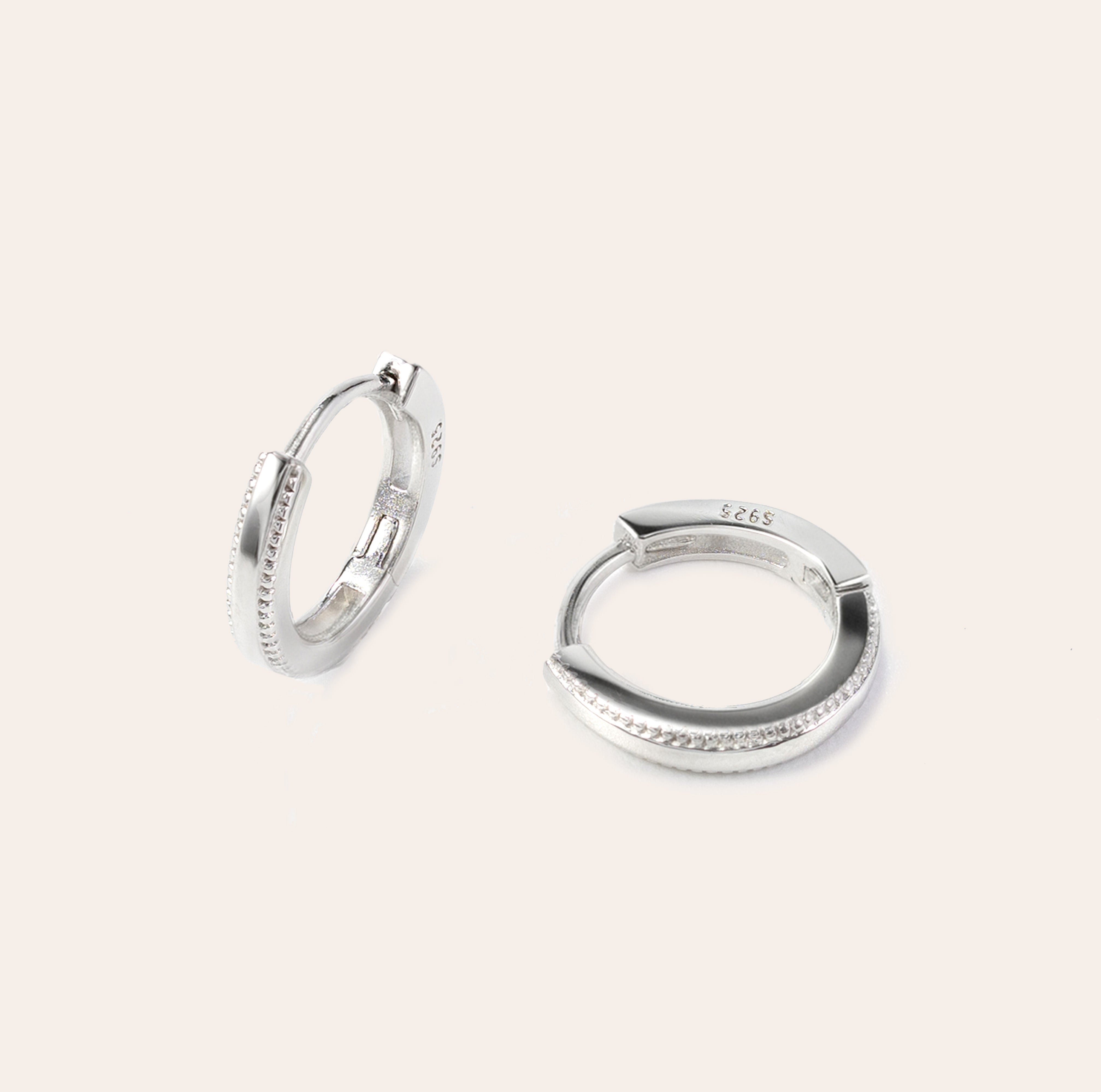 Onita white gold huggie earrings in vermeil over sterling silver with sculpted edge detailing, lightweight and sweatproof design by SILVBREEZE