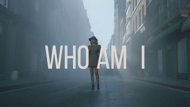 Silvbreeze MBTI “Who Am I” intro video featuring a woman walking through a foggy street, serving as the hero visual that leads to the four-color personality MBTI landing page.