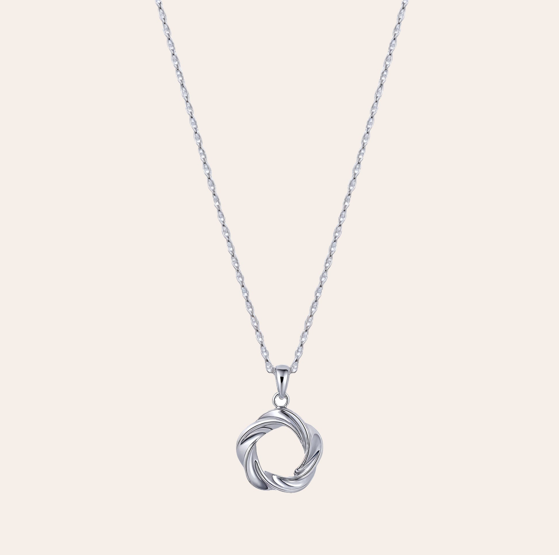 Vorta white gold vermeil pendant necklace with sculpted interwoven circle design, made from sterling silver, waterproof and lightweight athleisure jewelry by SILVBREEZE.
