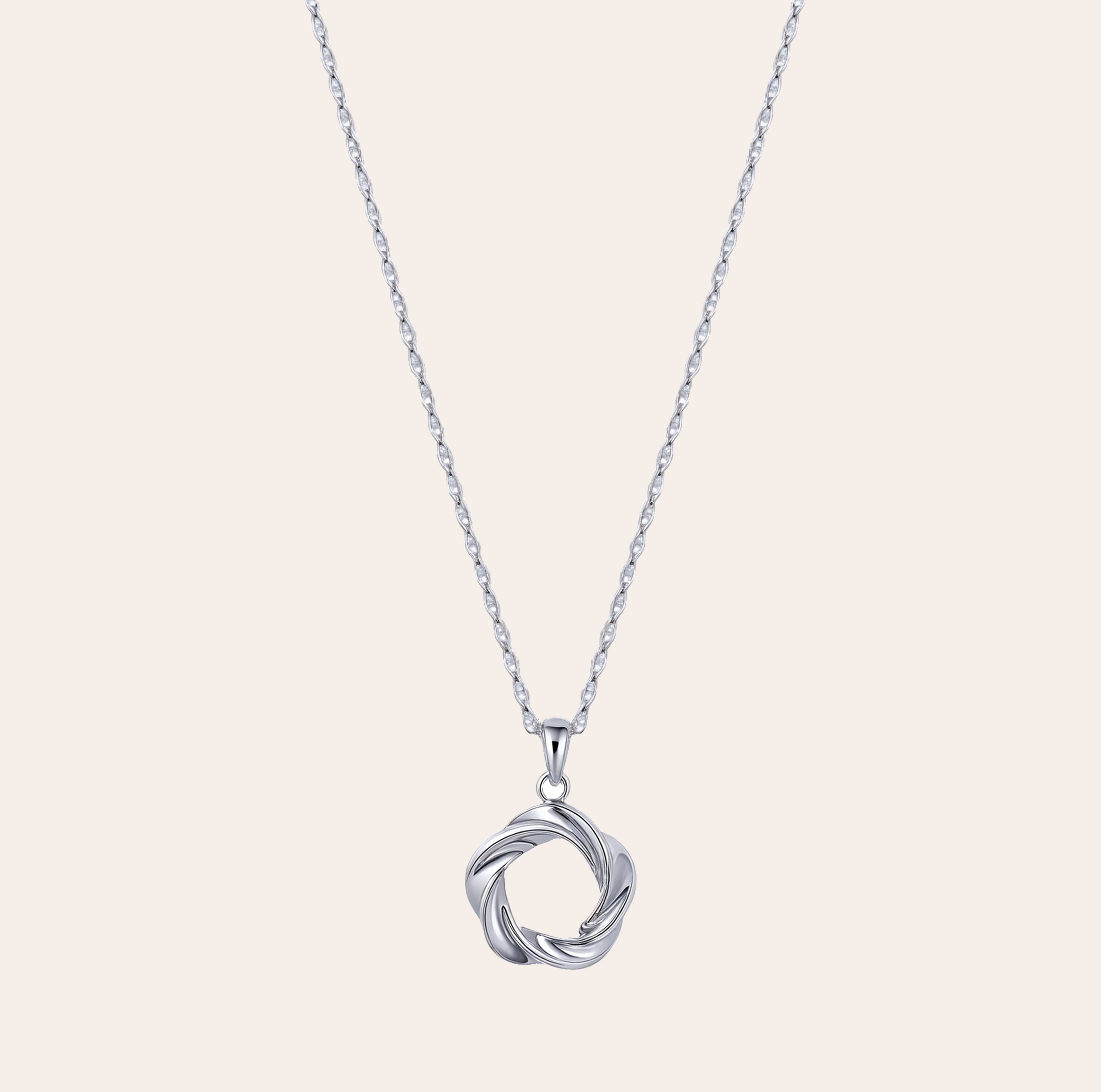 Vorta white gold vermeil pendant necklace with sculpted interwoven circle design, made from sterling silver, waterproof and lightweight athleisure jewelry by SILVBREEZE.